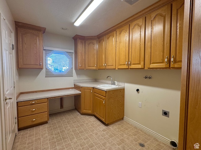 362 S Glen Cir, Fruit Heights, UT 84037 - laundry area with baseboards, light floors, a sink, electric dryer hookup, and cabinet space