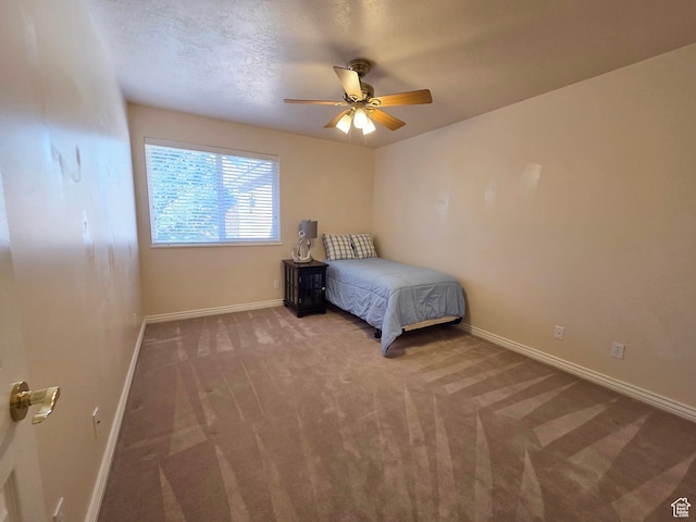 362 S Glen Cir, Fruit Heights, UT 84037 - unfurnished bedroom with baseboards, a textured ceiling, a ceiling fan, and carpet