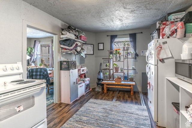 629 S 400 E, Salt Lake City, UT 84111 - kitchen featuring wood finished floors, a textured ceiling, and white appliances