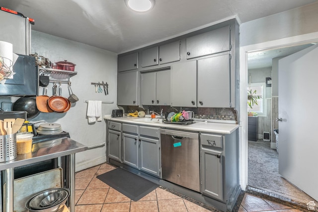 629 S 400 E, Salt Lake City, UT 84111 - kitchen featuring light countertops, dishwasher, gray cabinetry, light tile patterned floors, and decorative backsplash