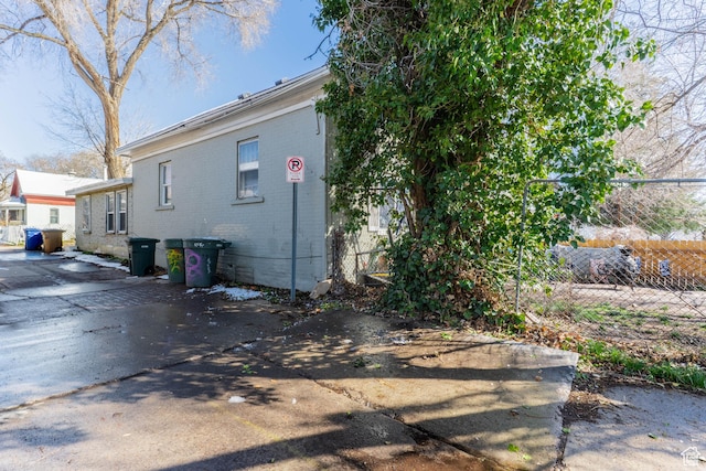 629 S 400 E, Salt Lake City, UT 84111 - view of side of home with fence and brick siding