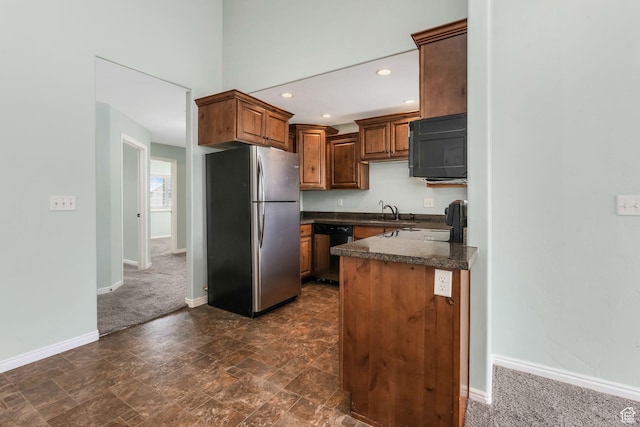 2522 W 500 S Unit 7, Springville, UT 84663 - kitchen featuring baseboards, dark countertops, dishwasher, freestanding refrigerator, and black microwave