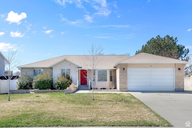 ranch-style house with concrete driveway, entry steps, a front yard, brick siding, and a garage