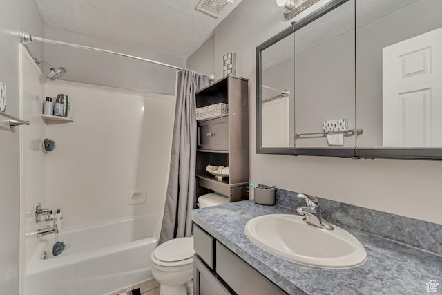 333 S Monroe Blvd Unit 23, Ogden, UT 84404 - bathroom featuring toilet, shower / tub combo with curtain, vanity, a textured ceiling, and visible vents