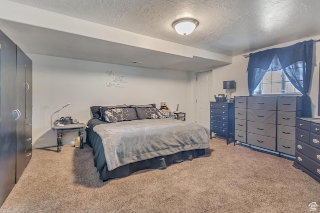 333 S Monroe Blvd Unit 23, Ogden, UT 84404 - carpeted bedroom featuring a textured ceiling