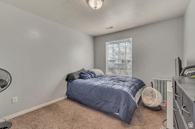333 S Monroe Blvd Unit 23, Ogden, UT 84404 - carpeted bedroom featuring baseboards, a textured ceiling, and visible vents