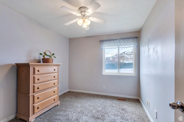 bedroom featuring a ceiling fan, baseboards, and light colored carpet