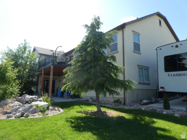 4613 W Brookport Cir S Unit V3-8, Herriman, UT 84096 - view of side of property featuring a lawn and stucco siding