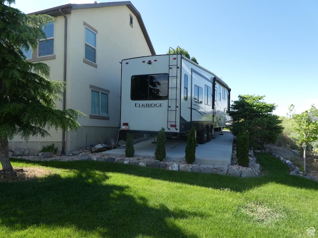 4613 W Brookport Cir S Unit V3-8, Herriman, UT 84096 - view of side of property with a yard and stucco siding