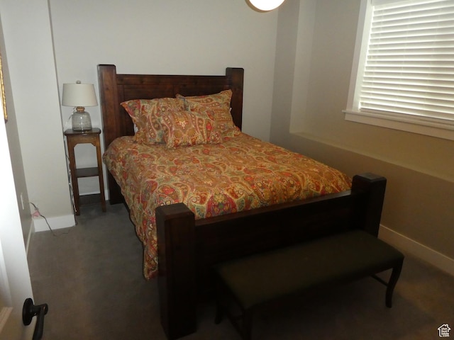 bedroom with carpet floors and baseboards