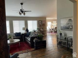 living area with ceiling fan and wood finished floors