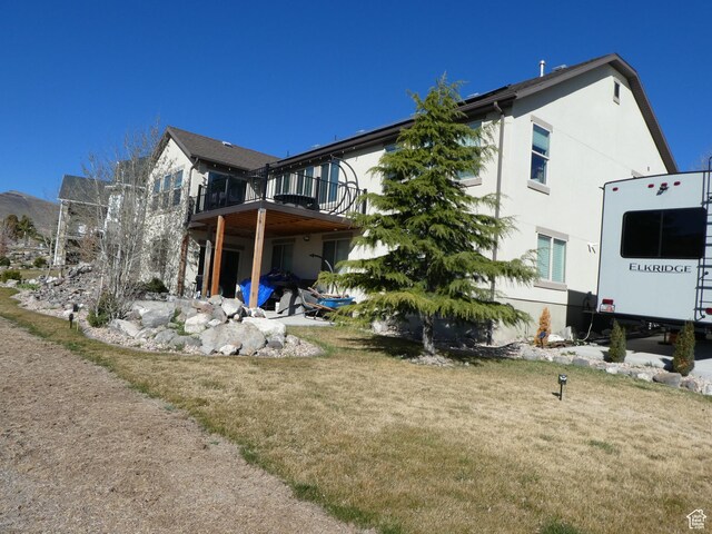 back of property with stucco siding