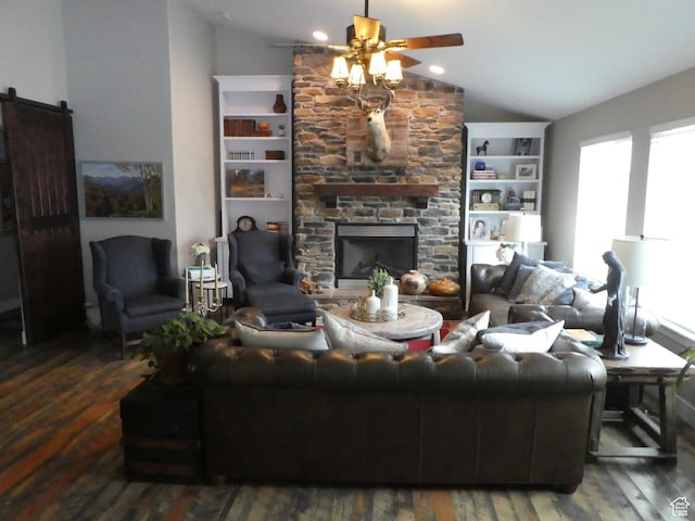 living room featuring lofted ceiling, wood finished floors, a healthy amount of sunlight, and a ceiling fan
