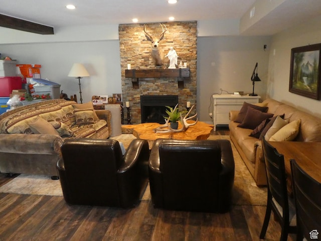 living room featuring a fireplace, wood finished floors, and recessed lighting