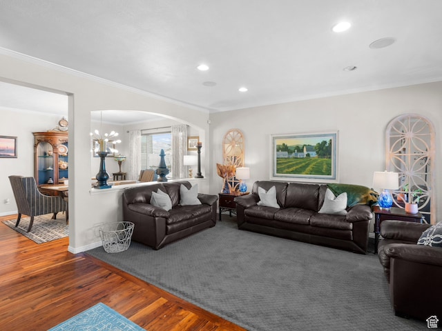 14526 Long Ridge Dr, Herriman, UT 84096 - living area with arched walkways, baseboards, ornamental molding, and wood finished floors
