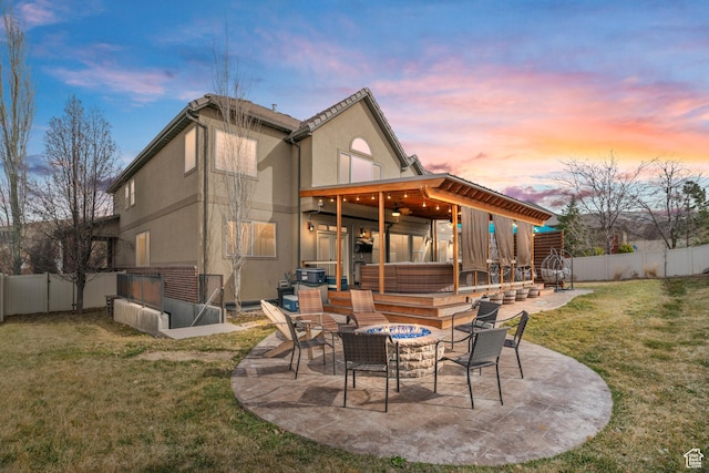 14526 Long Ridge Dr, Herriman, UT 84096 - back of house with stucco siding, a fenced backyard, an outdoor fire pit, a yard, and a patio area