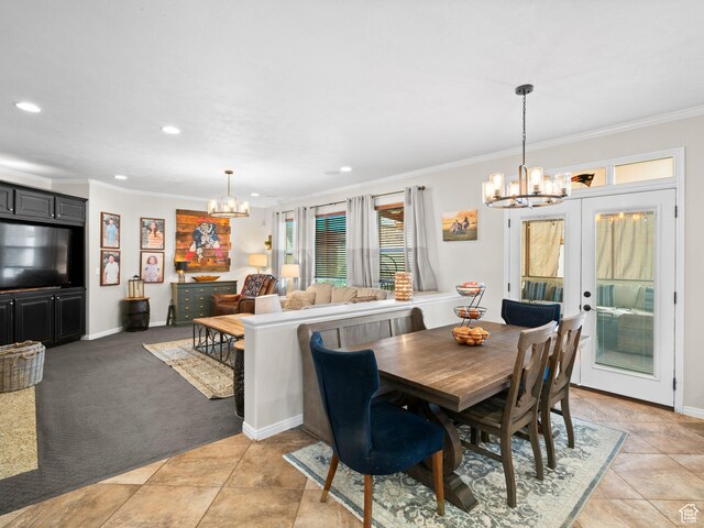 14526 Long Ridge Dr, Herriman, UT 84096 - dining area featuring french doors, ornamental molding, a chandelier, and recessed lighting