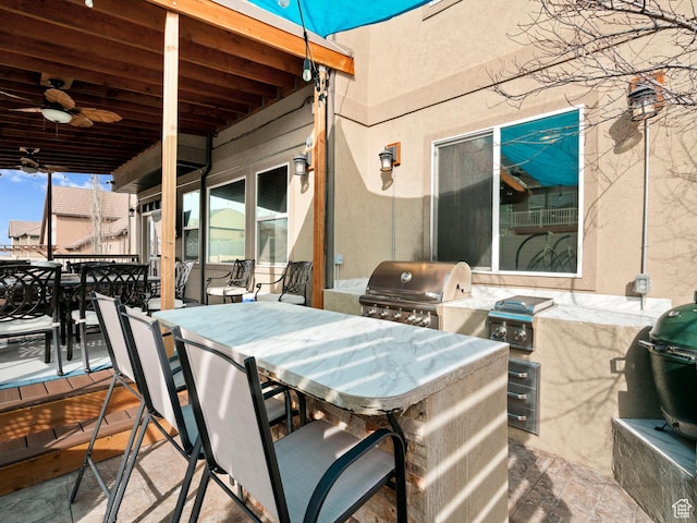 14526 Long Ridge Dr, Herriman, UT 84096 - view of patio with grilling area, ceiling fan, an outdoor kitchen, and outdoor dining space