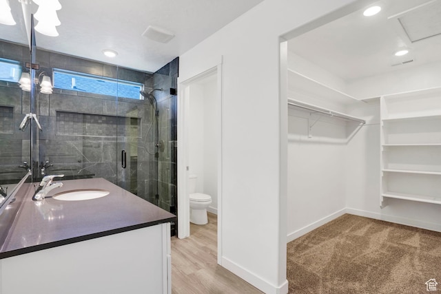 900 E Mecham Ave, Layton, UT 84040 - full bath with vanity, a walk in closet, toilet, baseboards, and a stall shower