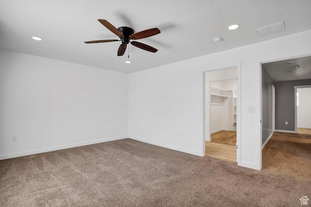 900 E Mecham Ave, Layton, UT 84040 - unfurnished bedroom with carpet flooring, a walk in closet, baseboards, visible vents, and recessed lighting