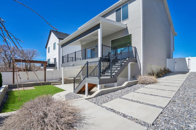 900 E Mecham Ave, Layton, UT 84040 - view of side of property with a gate, ceiling fan, a fenced backyard, and stairs