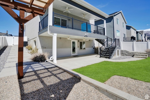 900 E Mecham Ave, Layton, UT 84040 - rear view of house featuring stucco siding, stairs, a fenced backyard, ceiling fan, and a patio area