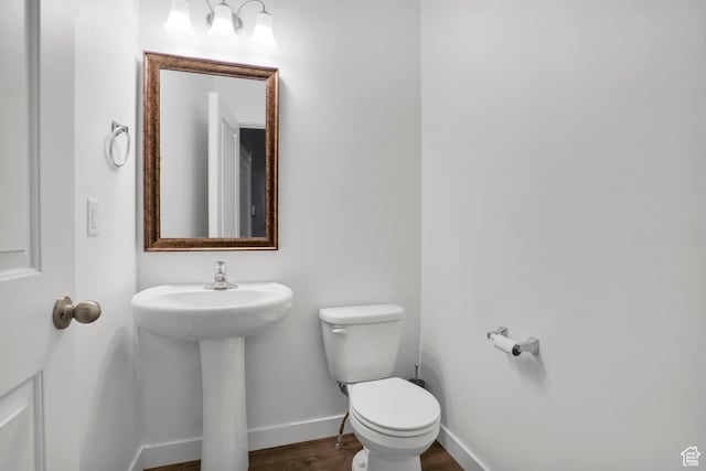 900 E Mecham Ave, Layton, UT 84040 - bathroom with toilet, a sink, baseboards, and wood finished floors
