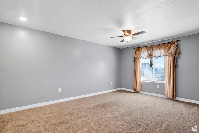 900 E Mecham Ave, Layton, UT 84040 - spare room with baseboards, light colored carpet, a textured ceiling, and a ceiling fan