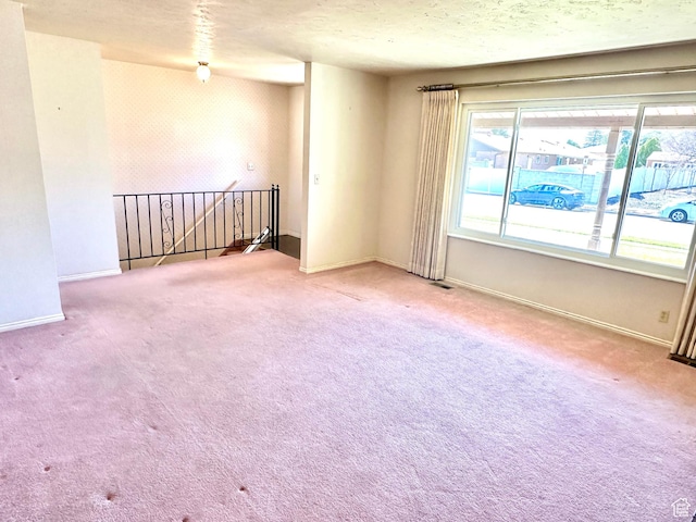 2662 W Toni Lee St, West Jordan, UT 84088 - spare room featuring baseboards, carpet flooring, and a textured ceiling