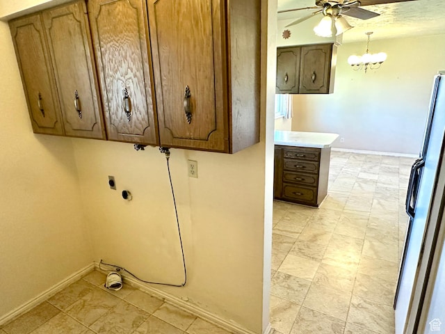 2662 W Toni Lee St, West Jordan, UT 84088 - laundry area featuring baseboards, cabinet space, ceiling fan with notable chandelier, and electric dryer hookup