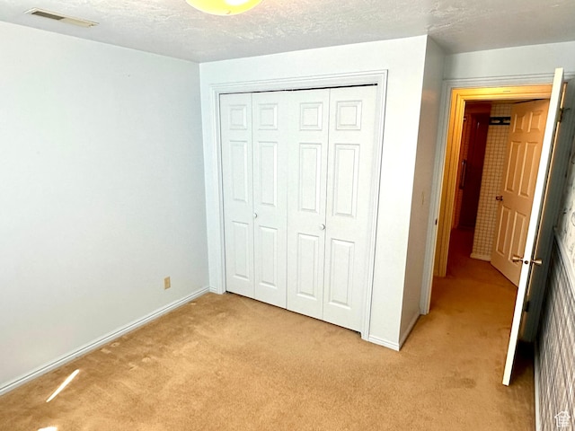 2662 W Toni Lee St, West Jordan, UT 84088 - unfurnished bedroom with light carpet, a textured ceiling, a closet, and visible vents