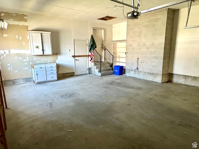 2662 W Toni Lee St, West Jordan, UT 84088 - garage featuring a garage door opener and concrete block wall