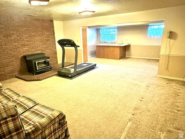 2662 W Toni Lee St, West Jordan, UT 84088 - exercise room featuring carpet, baseboards, a textured ceiling, and a wood stove