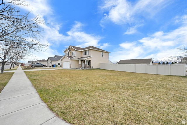 198 S 1130 E, Hyrum, UT 84319 - exterior space featuring concrete driveway, fence, and an attached garage