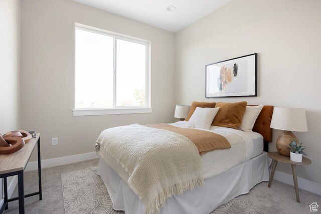 1562 E 3900 S Unit 107, Millcreek, UT 84124 - bedroom featuring light colored carpet and baseboards
