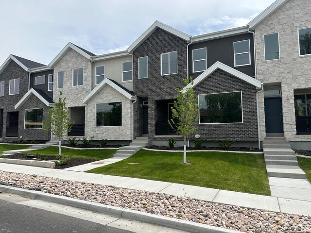 1562 E 3900 S Unit 107, Millcreek, UT 84124 - view of front of property with a front yard and stucco siding