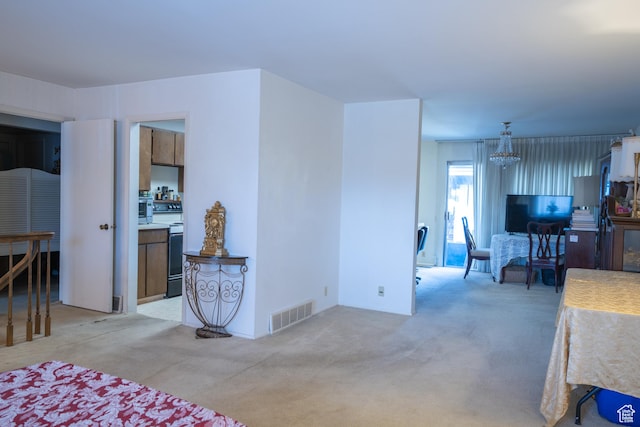 4971 S Beaver Brook Ln E Unit 40, Murray, UT 84117 - living area featuring visible vents, a chandelier, and light carpet