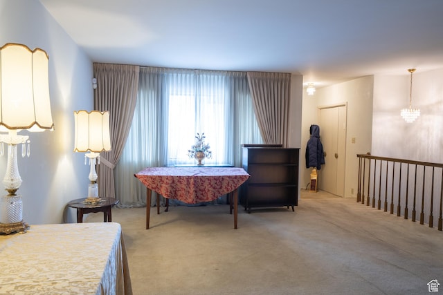 4971 S Beaver Brook Ln E Unit 40, Murray, UT 84117 - sitting room featuring carpet floors and a notable chandelier