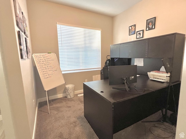 carpeted home office with baseboards