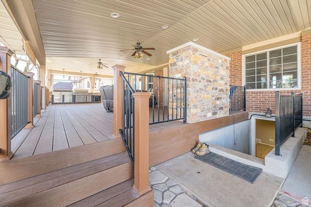 wooden terrace with a ceiling fan