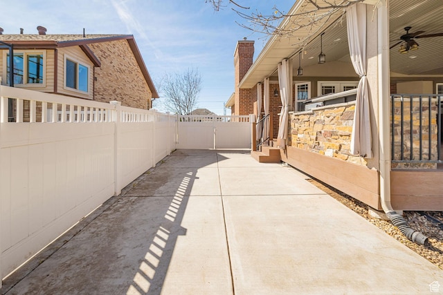 view of patio featuring fence