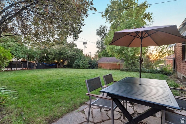 1311 E 29th St S, Ogden, UT 84403 - view of yard featuring a fenced backyard and outdoor dining area