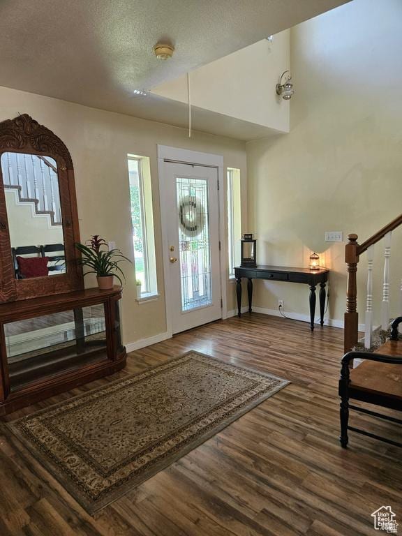 223 N 2520 W, Provo, UT 84601 - entrance foyer featuring baseboards, a textured ceiling, wood finished floors, and stairs