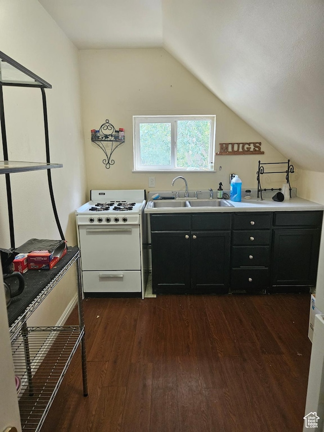 223 N 2520 W, Provo, UT 84601 - kitchen with white gas range, dark wood-type flooring, a sink, lofted ceiling, and dark cabinetry