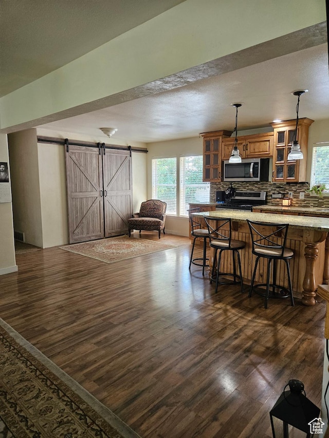 223 N 2520 W, Provo, UT 84601 - interior space with tasteful backsplash, appliances with stainless steel finishes, dark wood finished floors, and a wealth of natural light