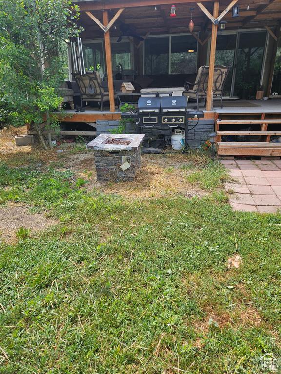 223 N 2520 W, Provo, UT 84601 - view of yard with an outdoor fire pit and a sunroom