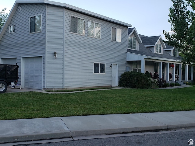 223 N 2520 W, Provo, UT 84601 - view of front of home featuring a garage and a front lawn