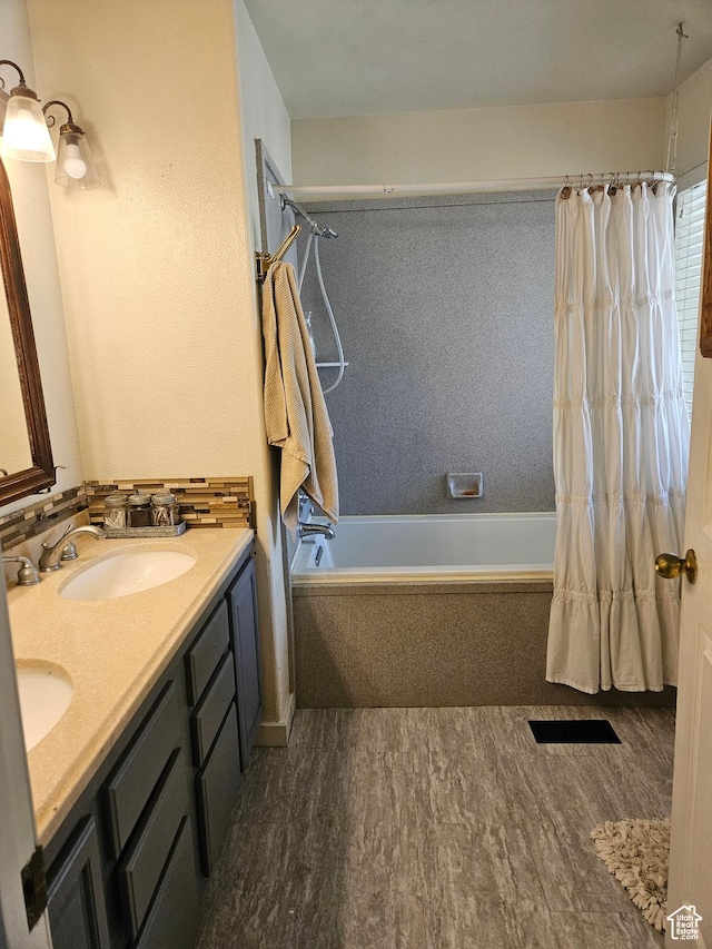 223 N 2520 W, Provo, UT 84601 - bathroom with double vanity, wood finished floors, shower / bath combo with shower curtain, and a sink
