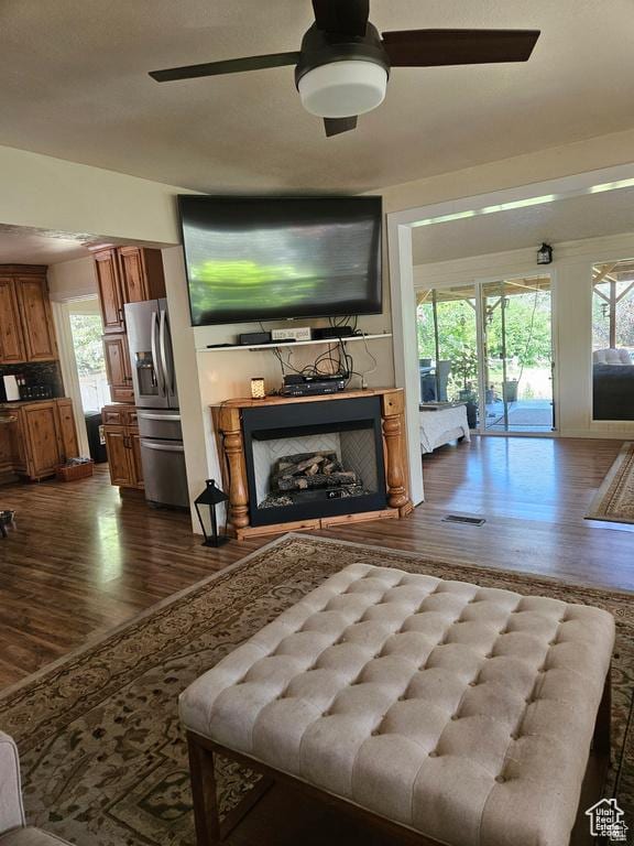 223 N 2520 W, Provo, UT 84601 - living room with visible vents, a ceiling fan, a fireplace, and dark wood finished floors
