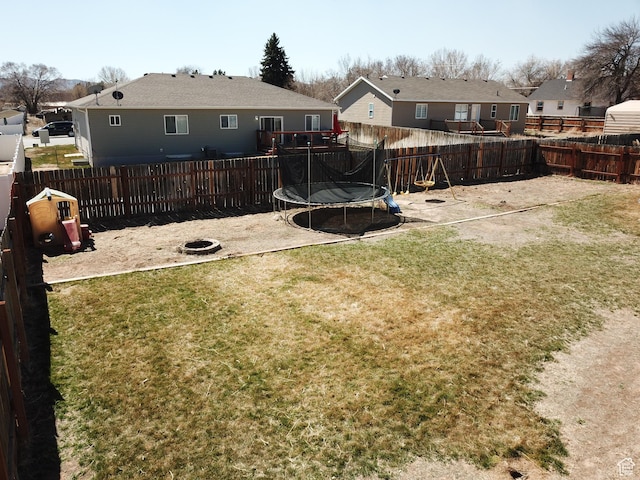 1451 W 925 S, Vernal, UT 84078 - view of yard featuring a patio, a residential view, a trampoline, and a fenced backyard